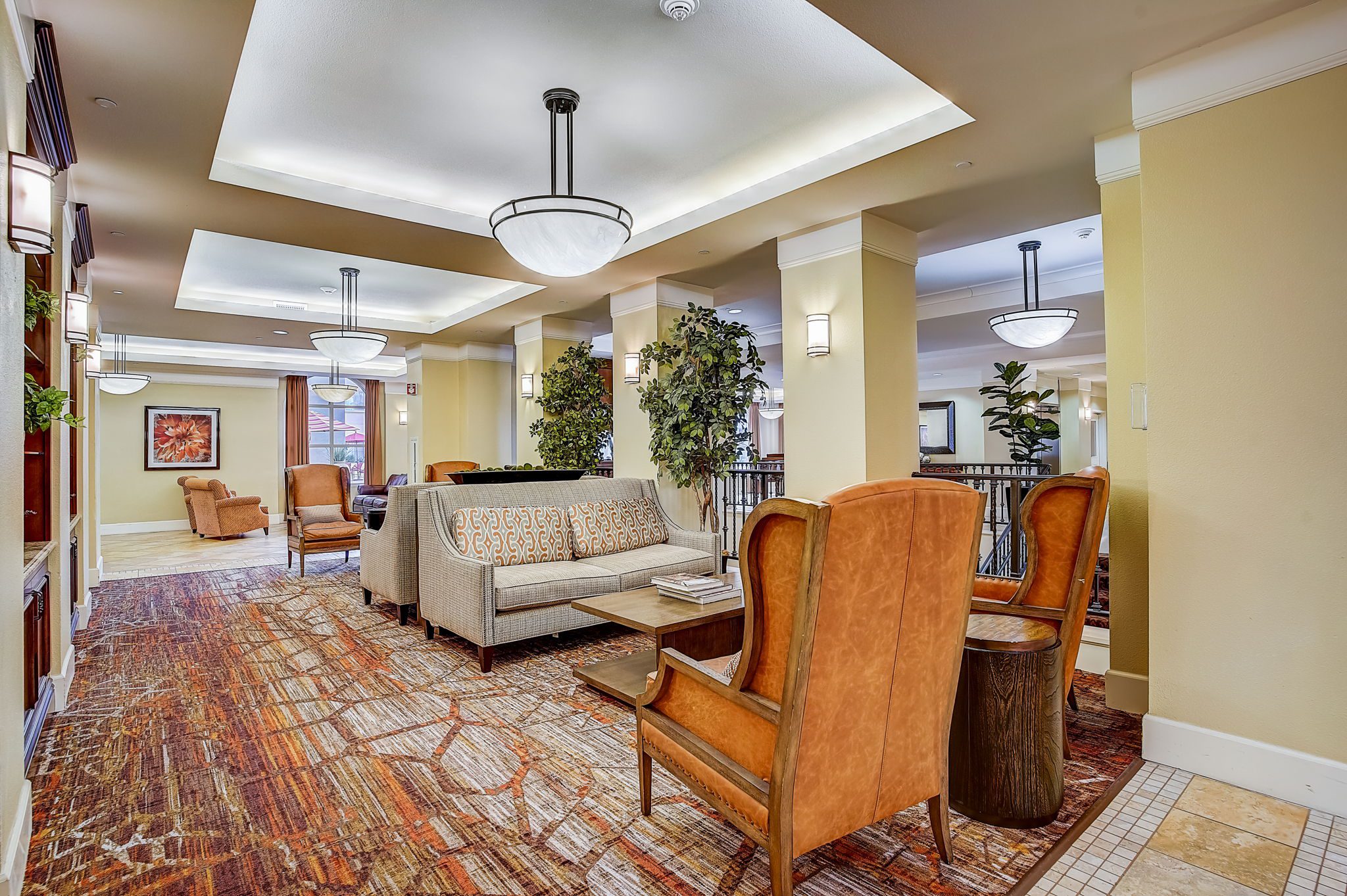 A community lobby with a spacious ceiling fan, creating a cool and inviting atmosphere.