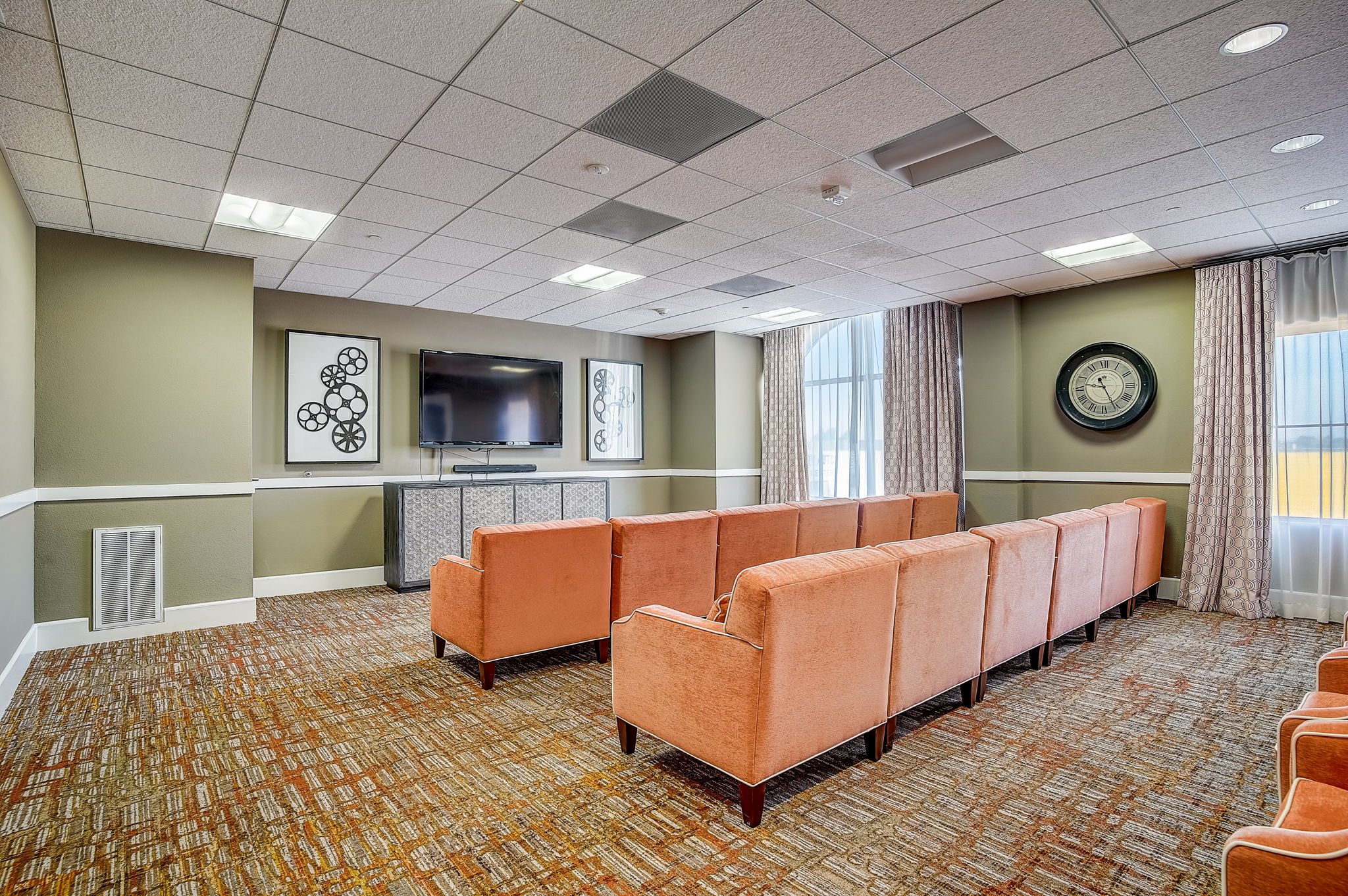 Movie theatre at peninsula del ray with comfortable seating and natural light.