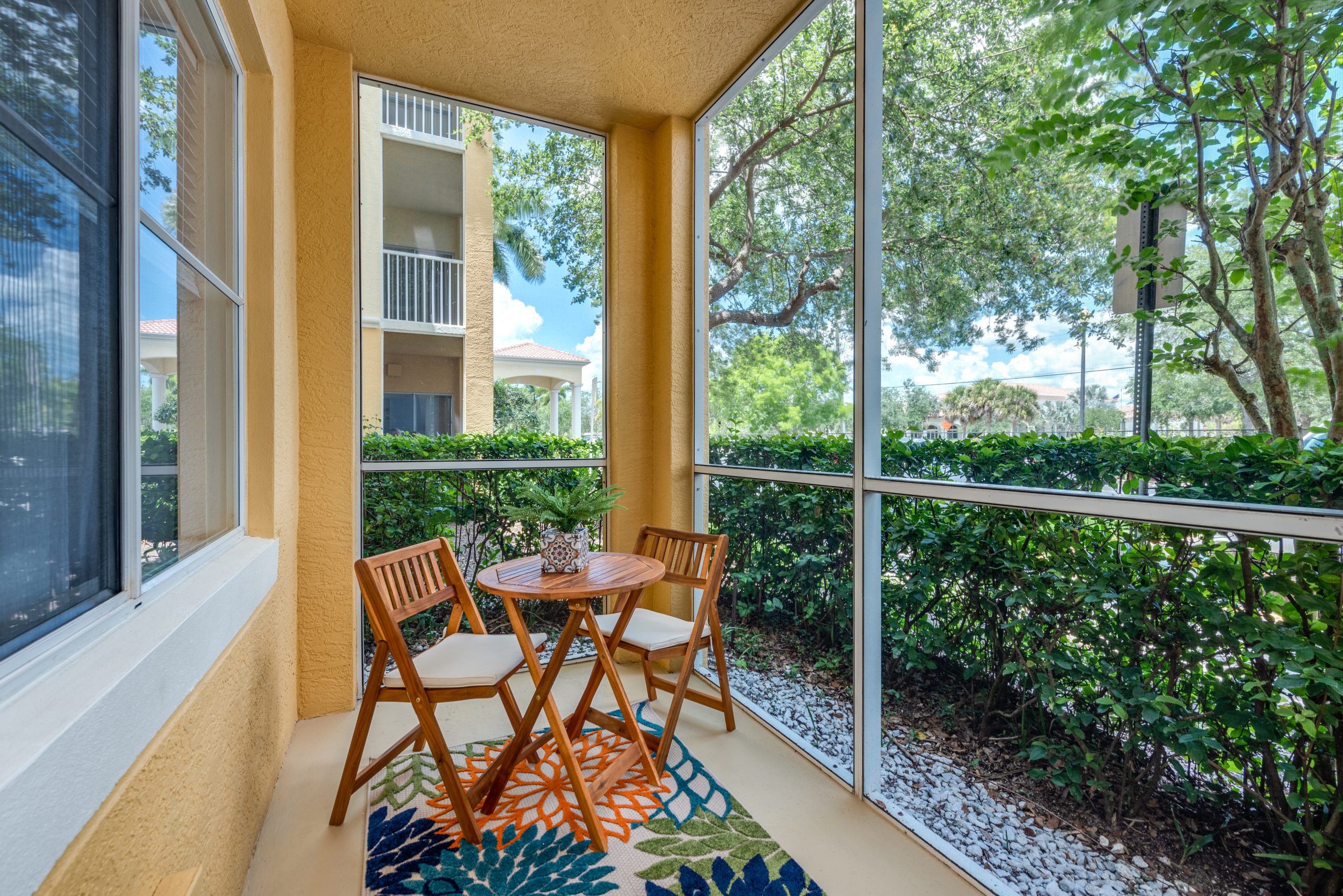 cozy outdoor patio of the carlisle naples community