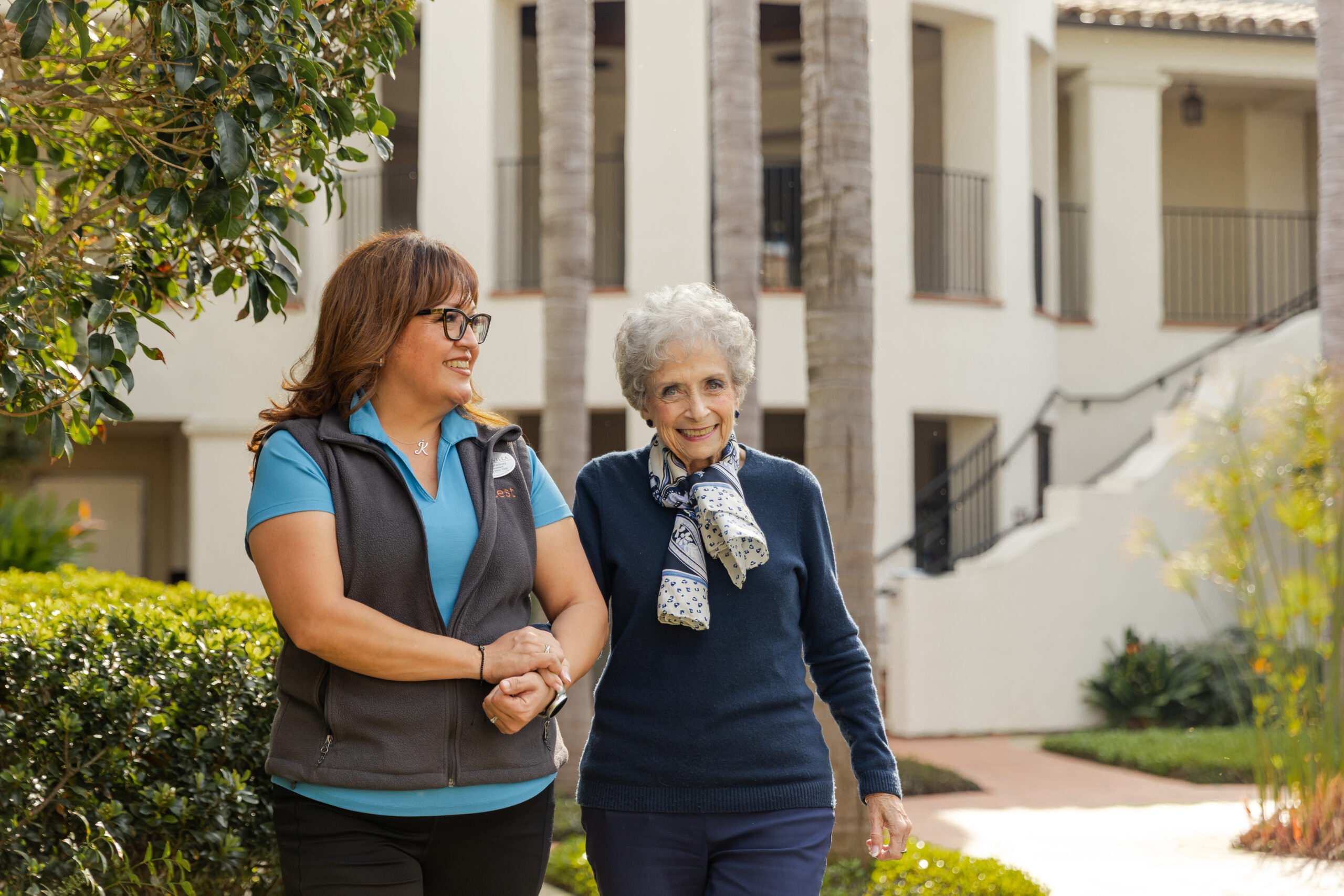 resident and caregiver walking