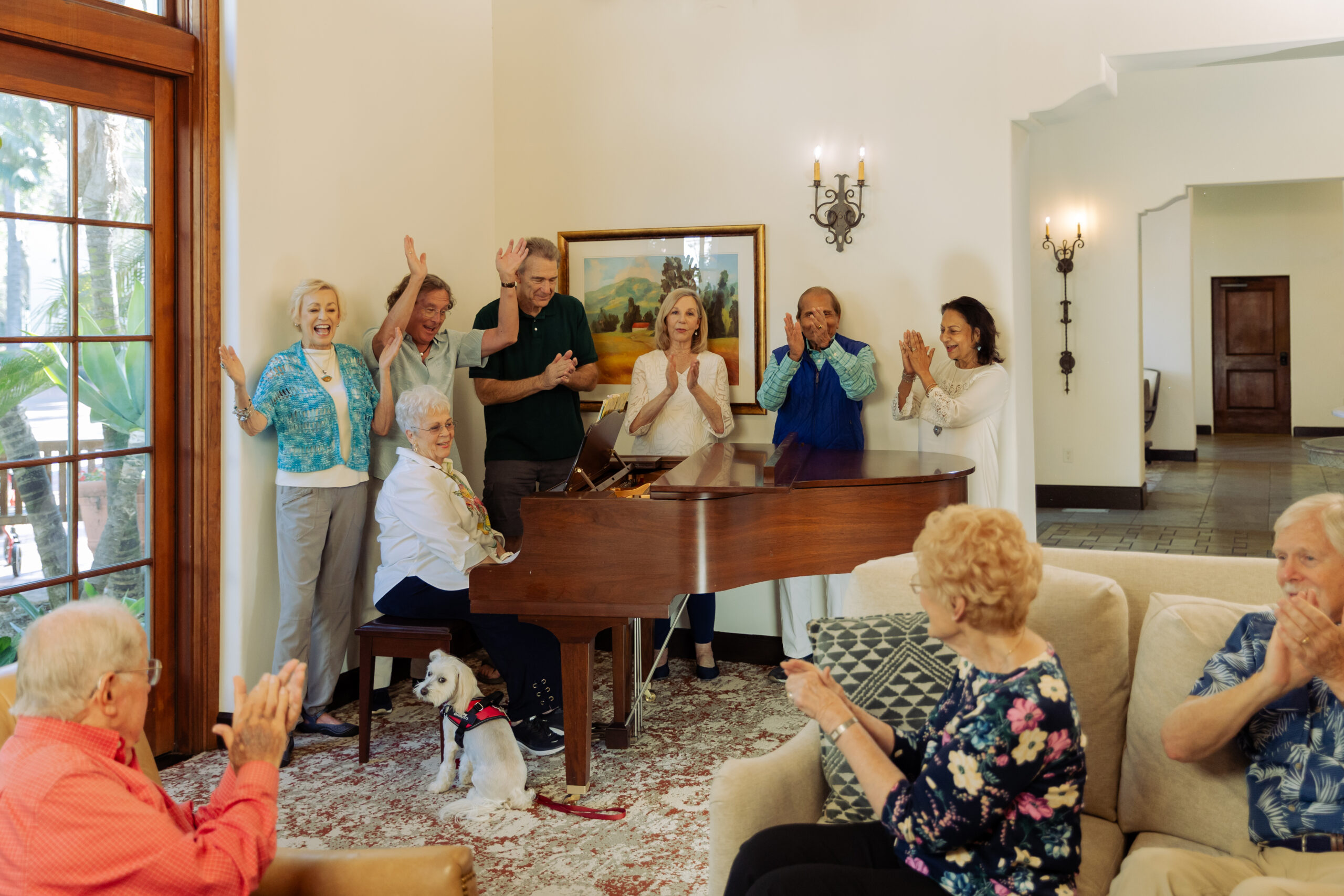 Seniors around a piano