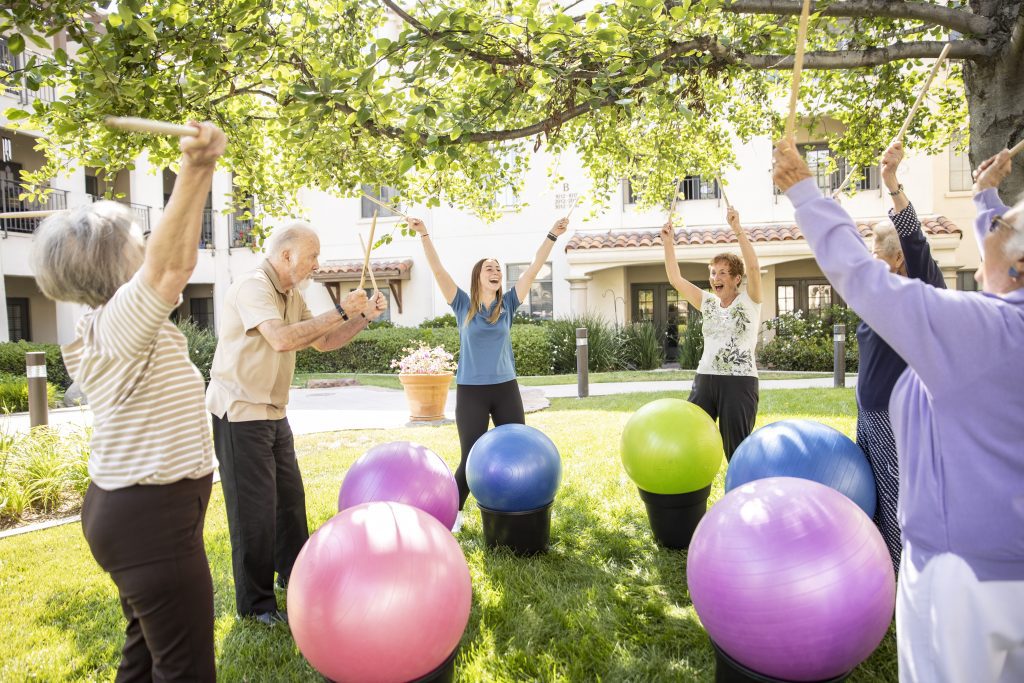 Group of older adults participating in outdoor fitness activity