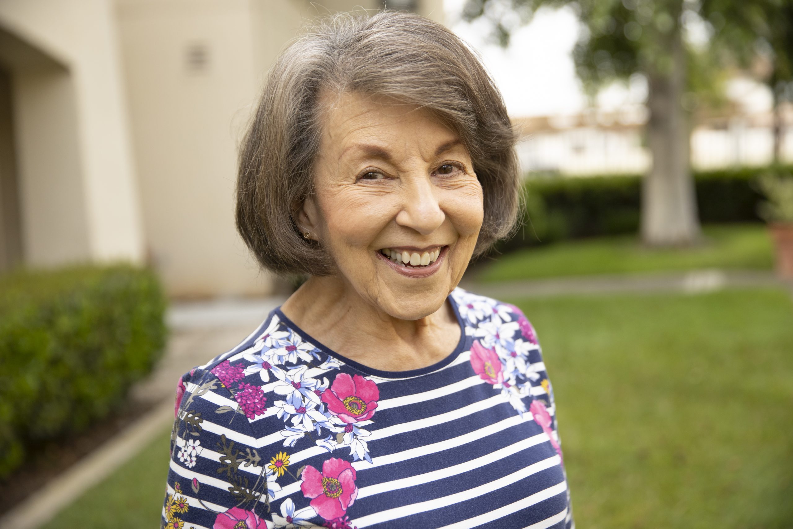 smiling happy elderly woman with striped shirt