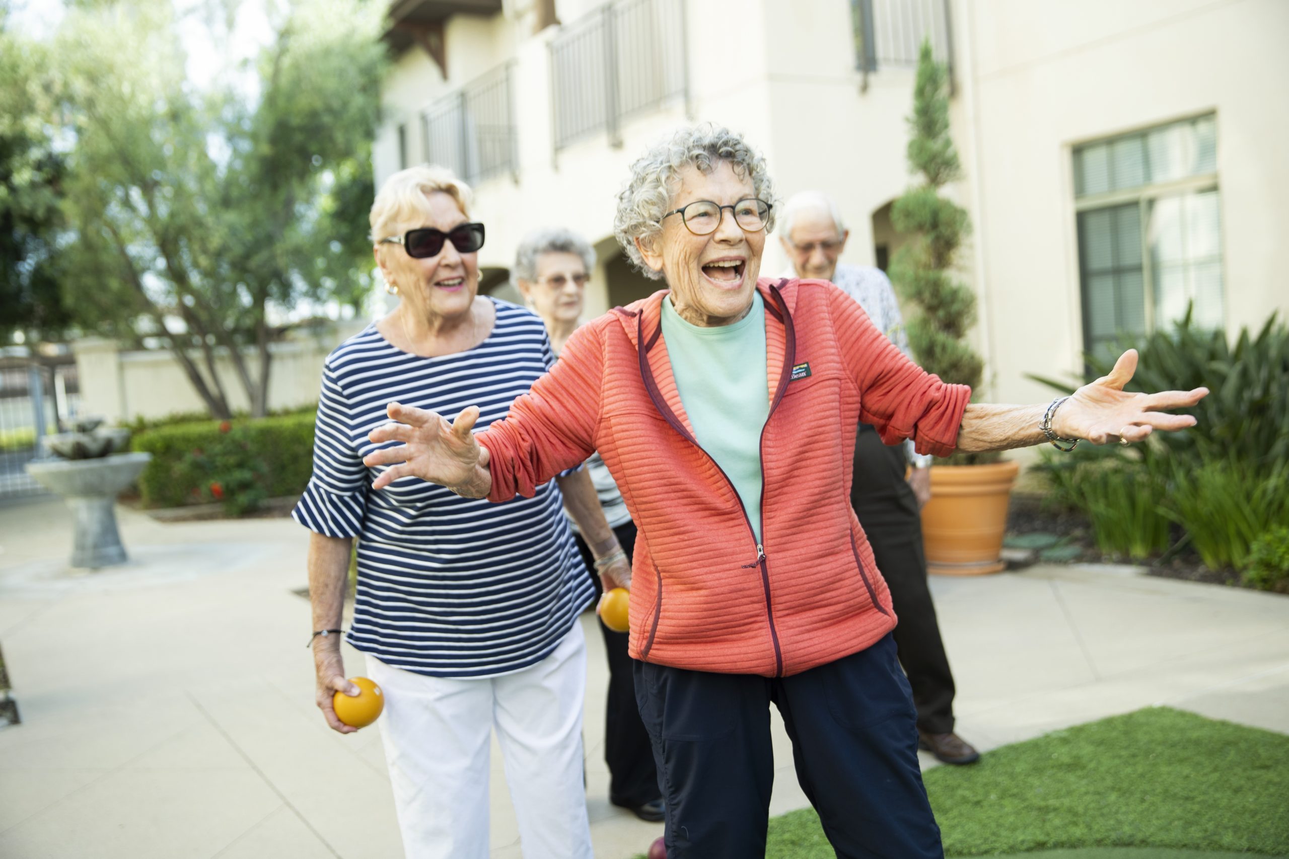 Senior women enjoying a talking to each other at a senior living community.