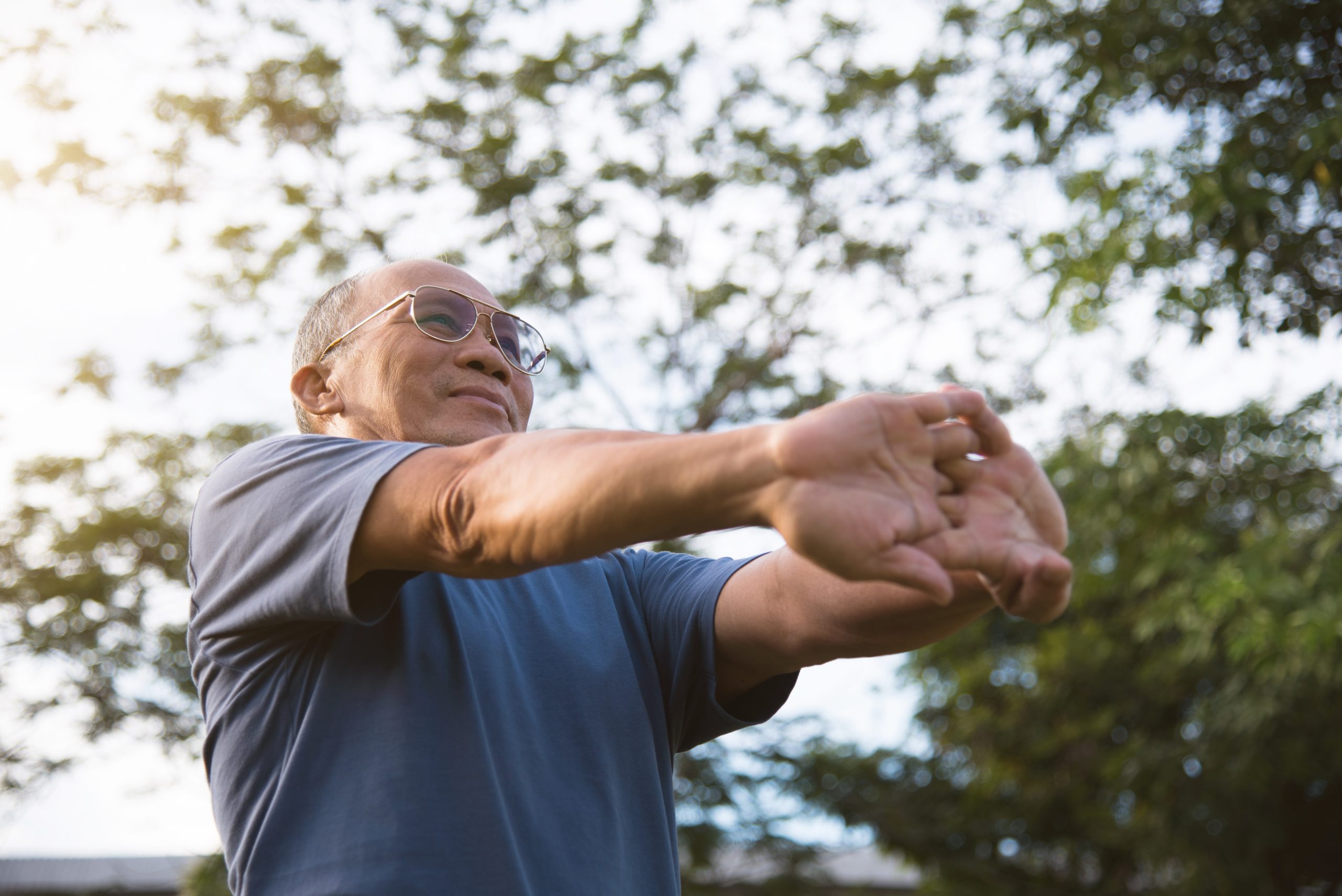 Elderly man stretching