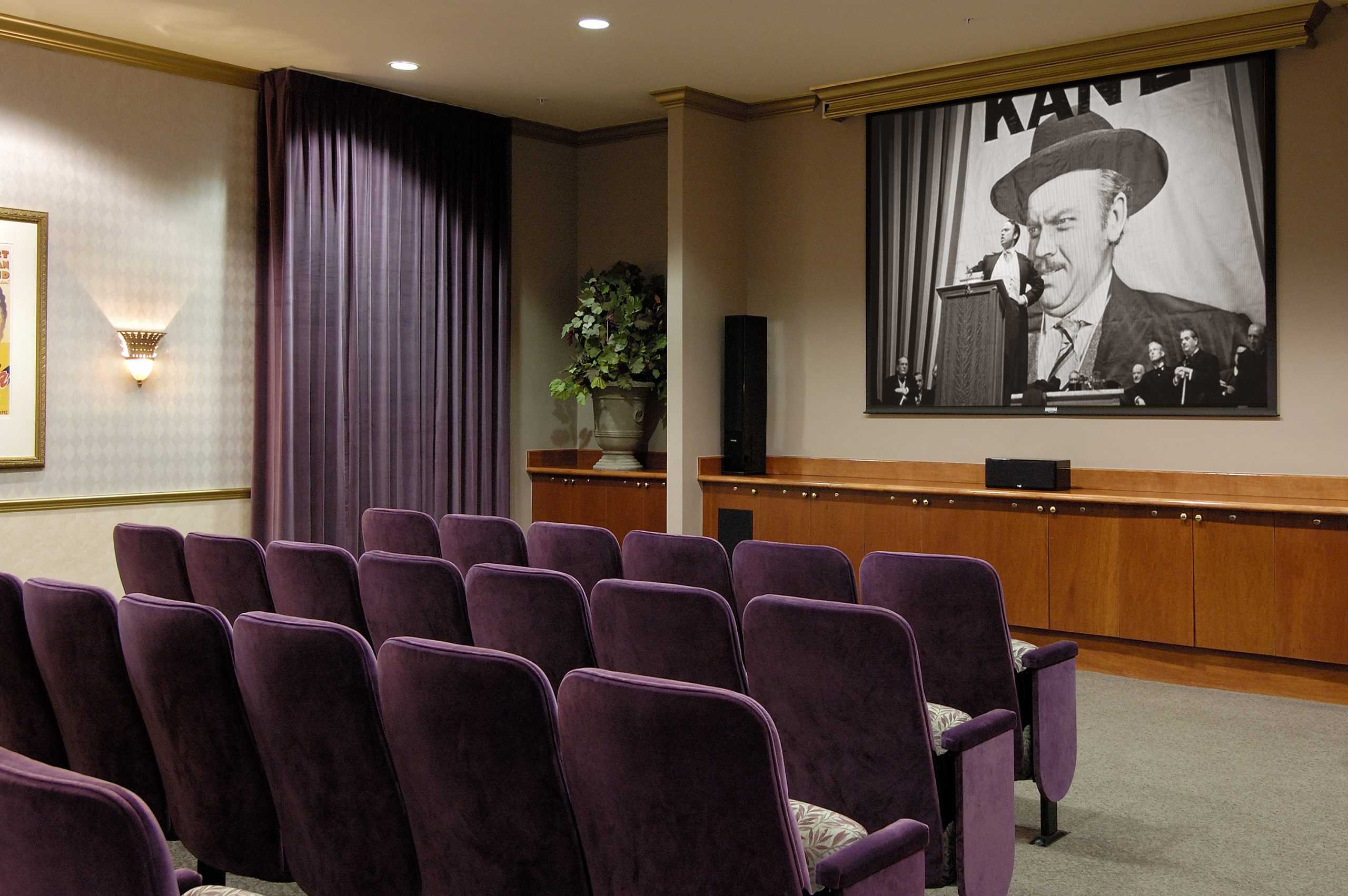 movie theater in a retirement community with about 20 seats that are purple