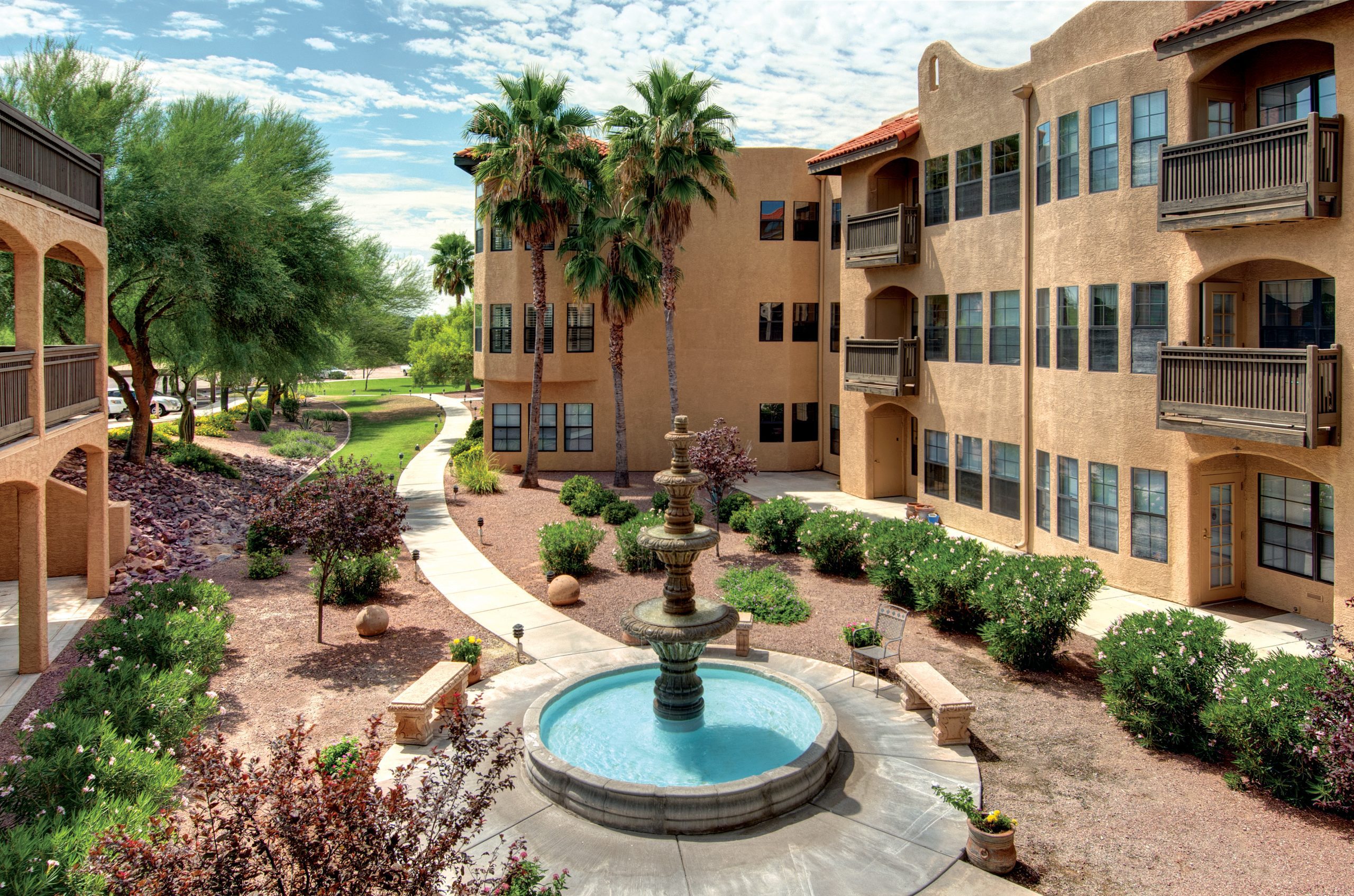The serene courtyard in Arizona, surrounded by lush greenery and charming architecture.
