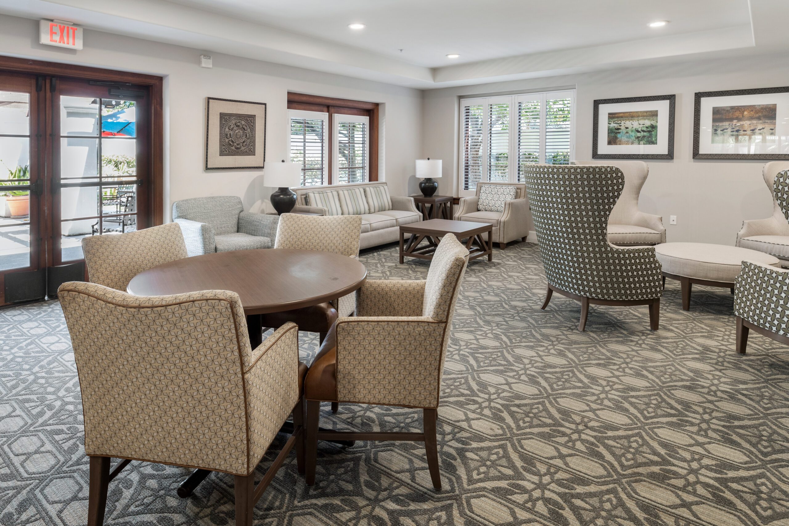 A cozy living room in a senior living community, featuring comfortable furniture and a warm ambiance.
