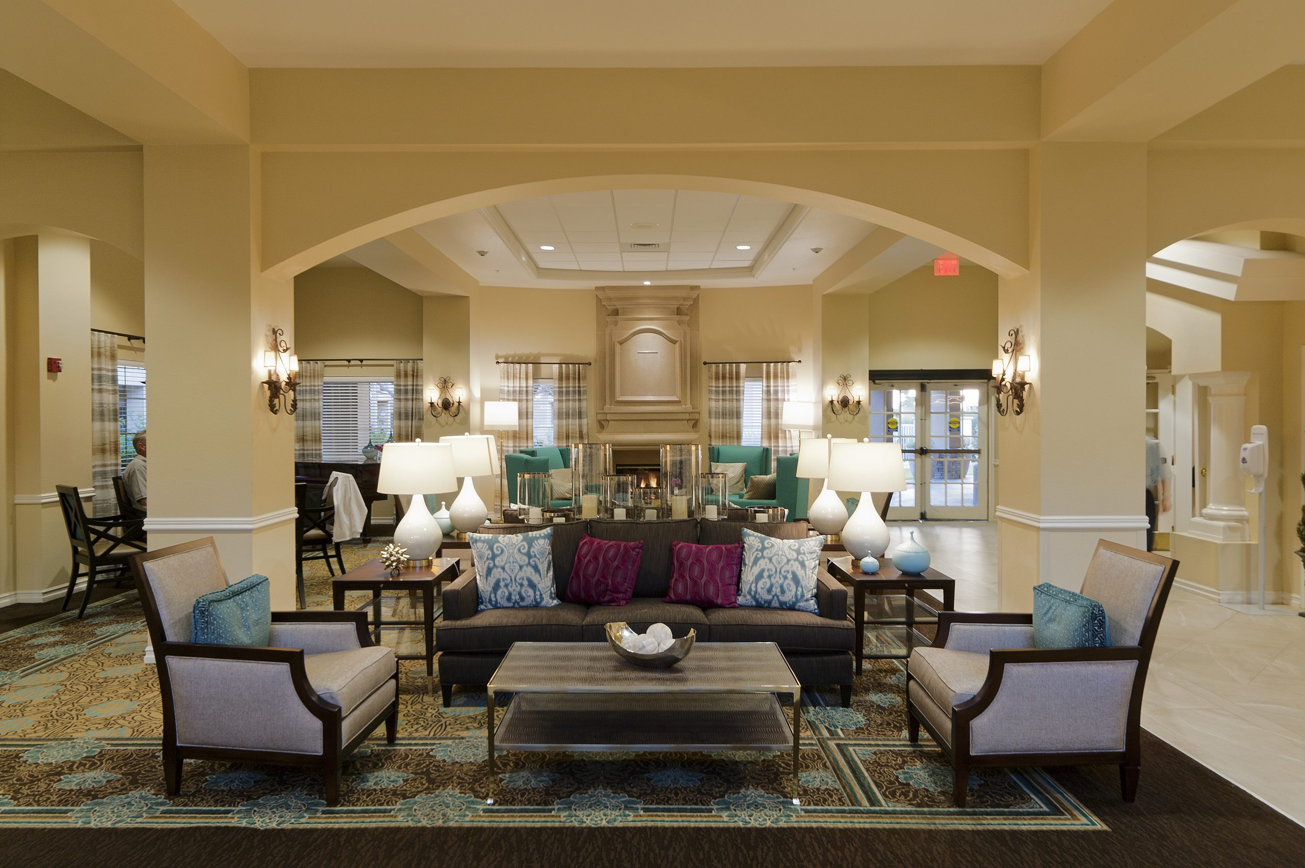 A lobby with a grand fireplace, creating a warm and inviting atmosphere for guests.