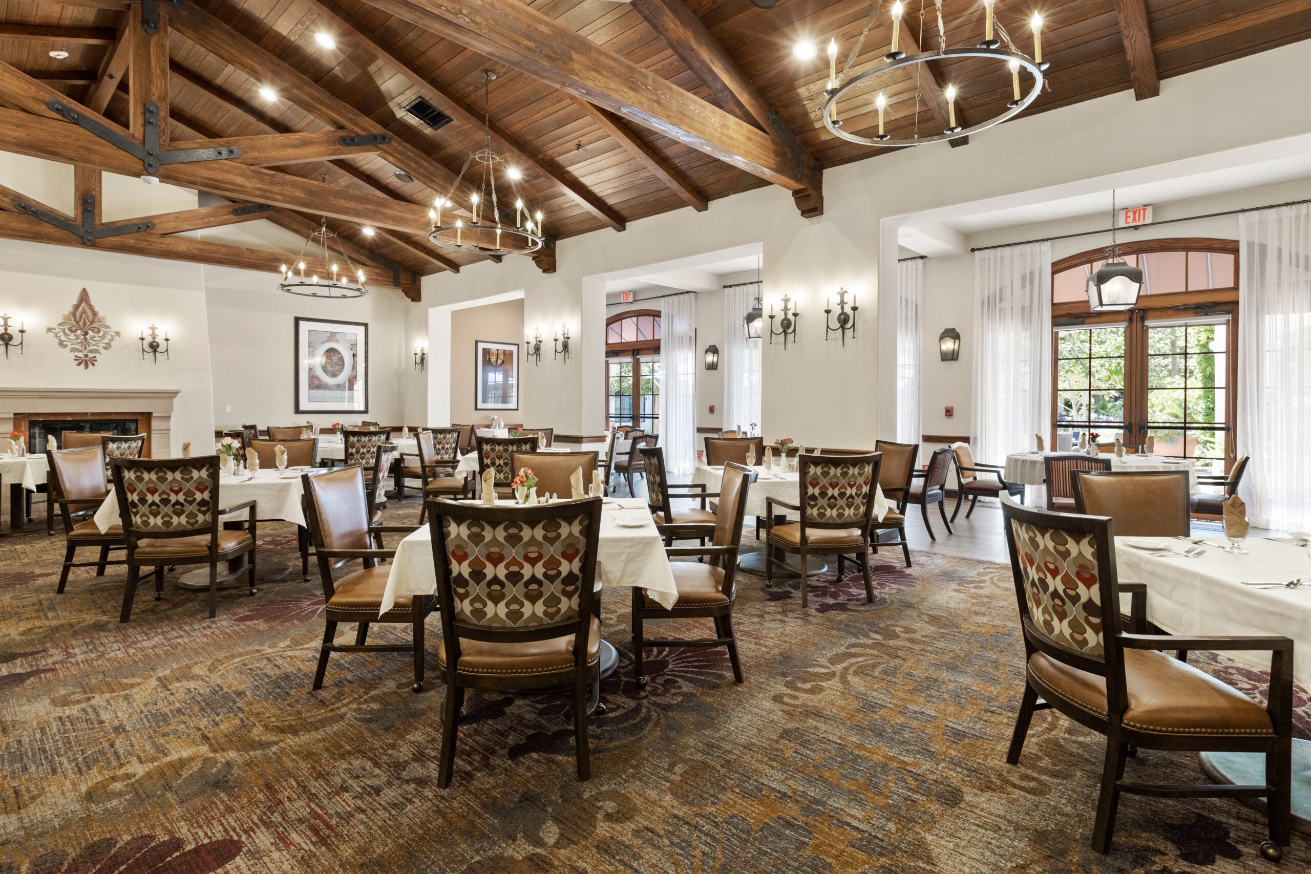 The cozy dining room, adorned with elegant furniture and warm lighting.