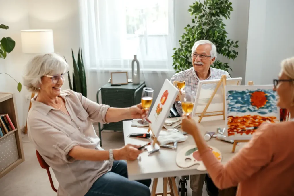 seniors painting together at a table