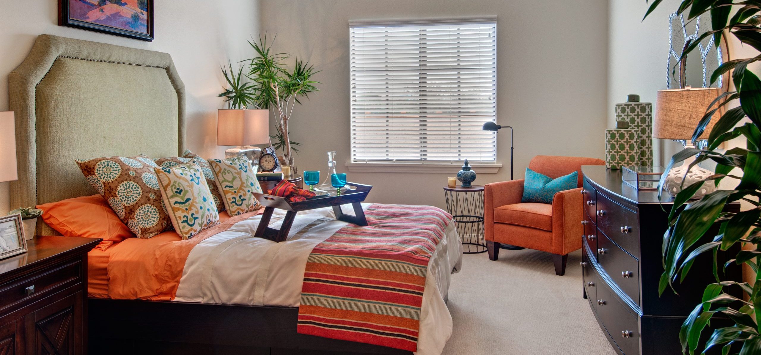 Model bedroom with cozy and upscale furniture