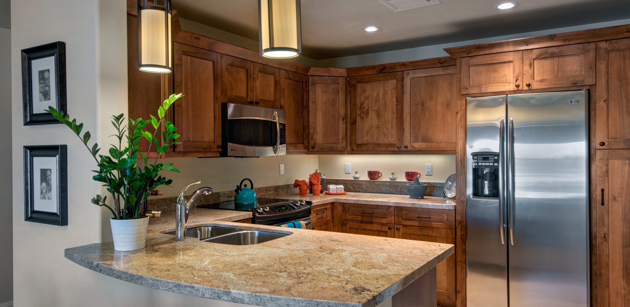 model kitchen with wooden cabinets and granite counters