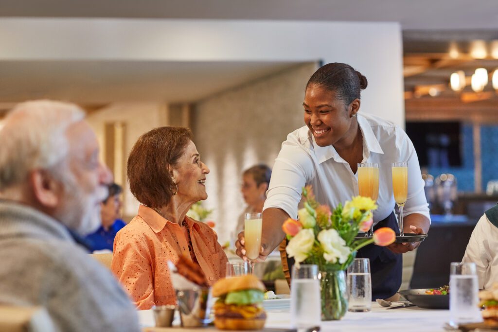 Seniors being served drinks