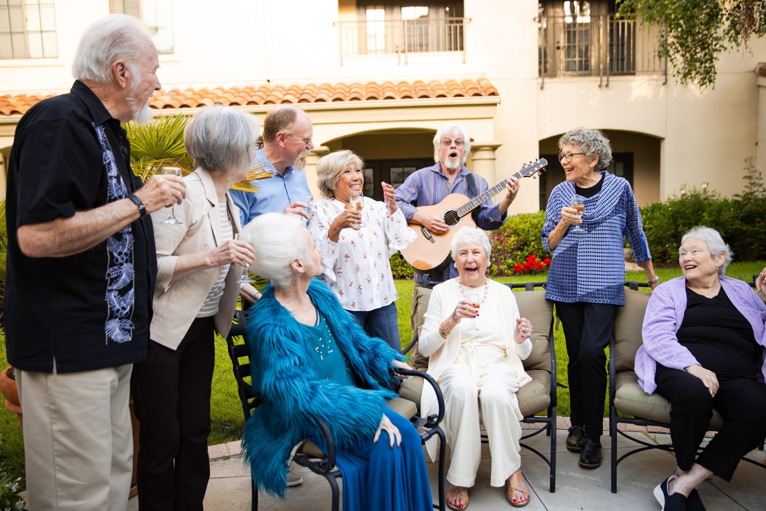 A diverse group of elderly individuals joyfully playing musical instruments together in harmony.