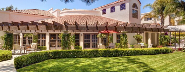 outside view of la vida del mar, with outer terrace and the building behind it