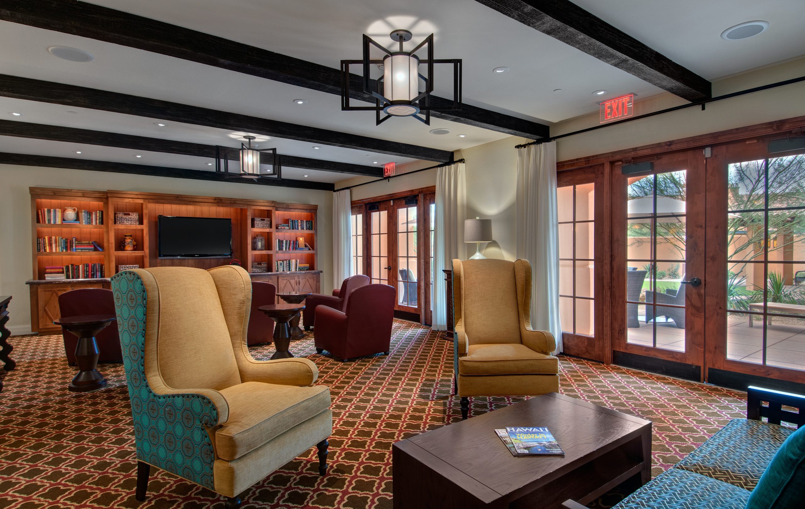 Cozy living room, featuring comfortable furniture and warm lighting.