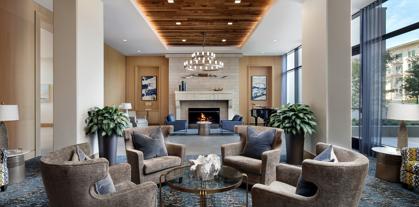 A cozy hotel lobby with a crackling fireplace and comfortable chairs, inviting guests to relax and unwind.