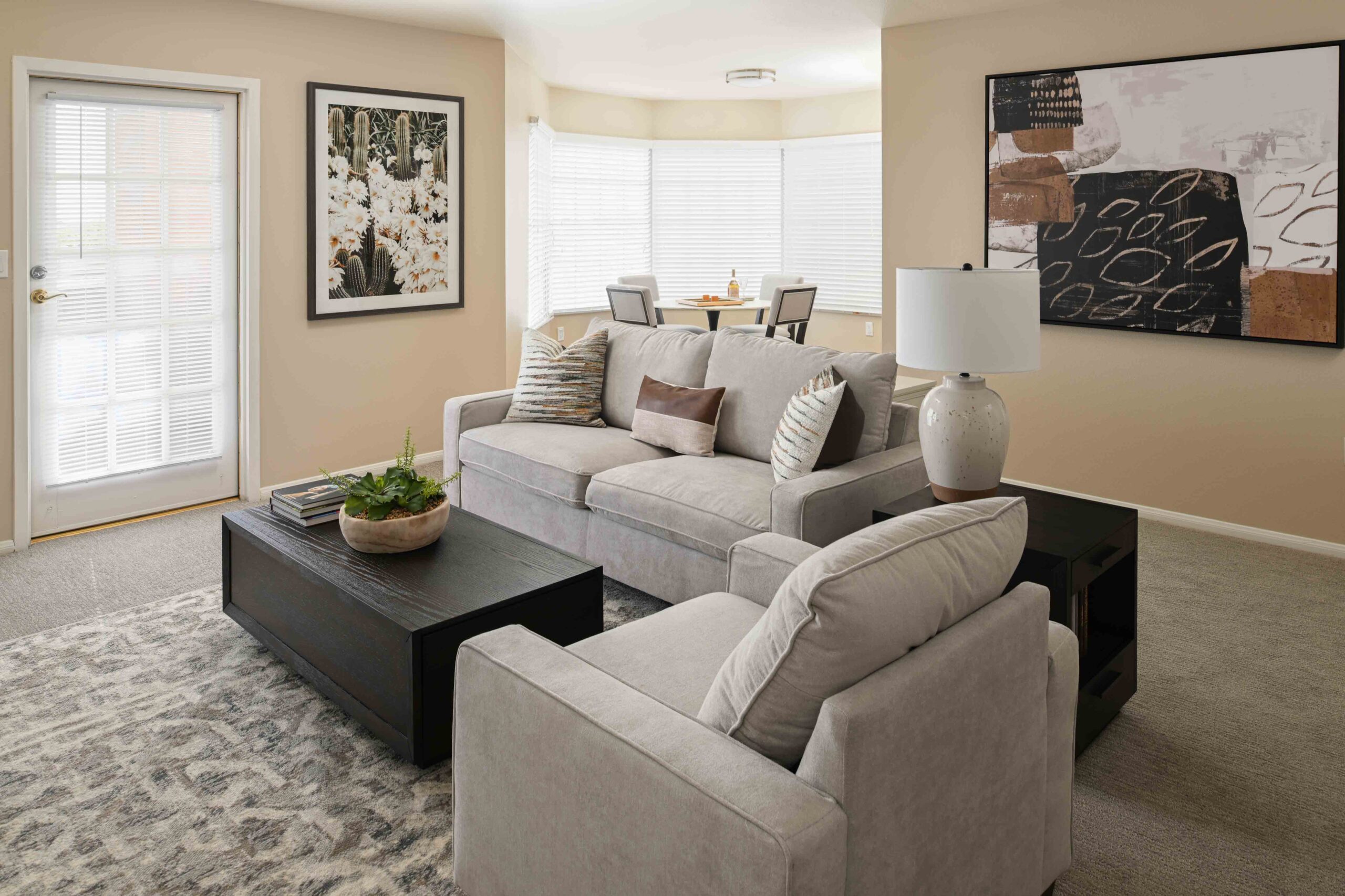 A cozy living room with a comfortable couch, a stylish coffee table, and a sleek television.