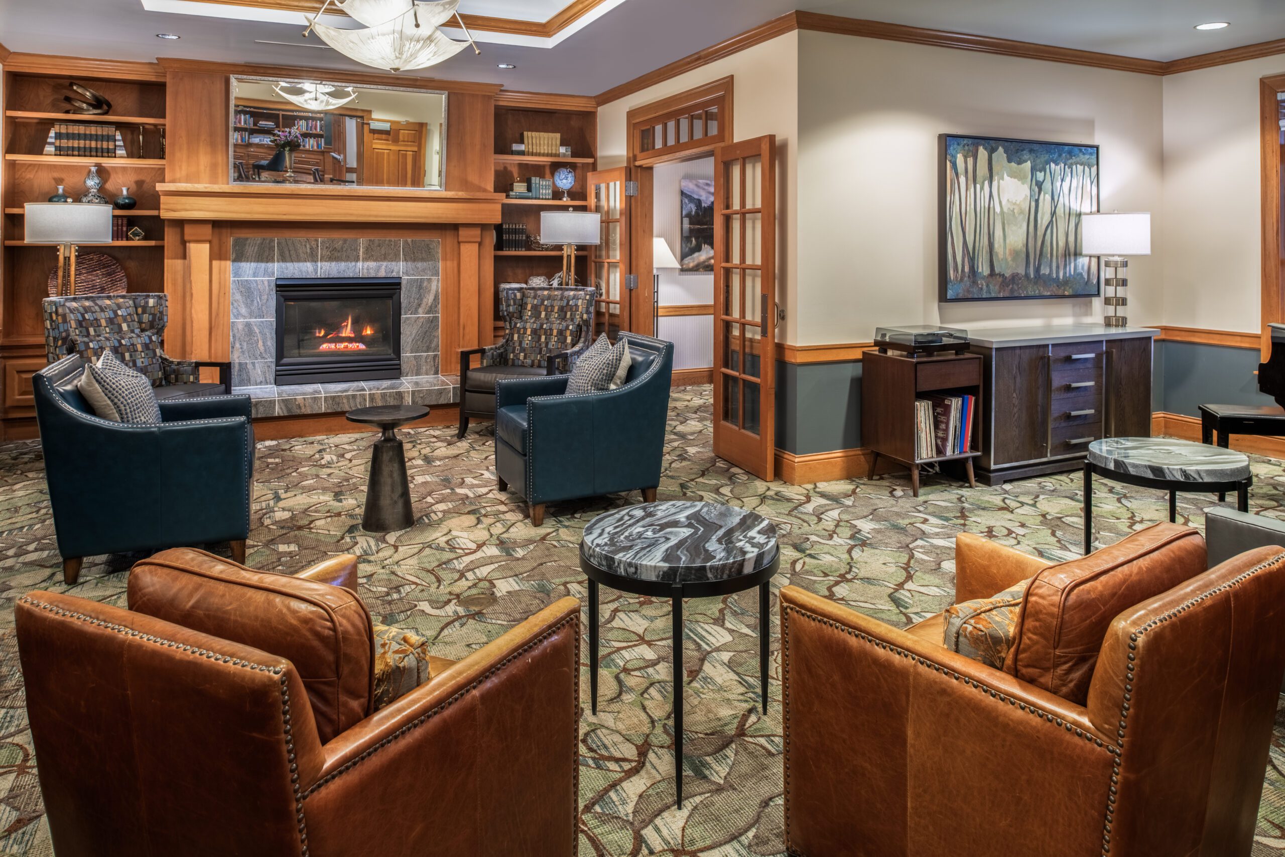 Living room at northwest place: cozy space with comfortable furniture, fireplace, and stunning mountain views.