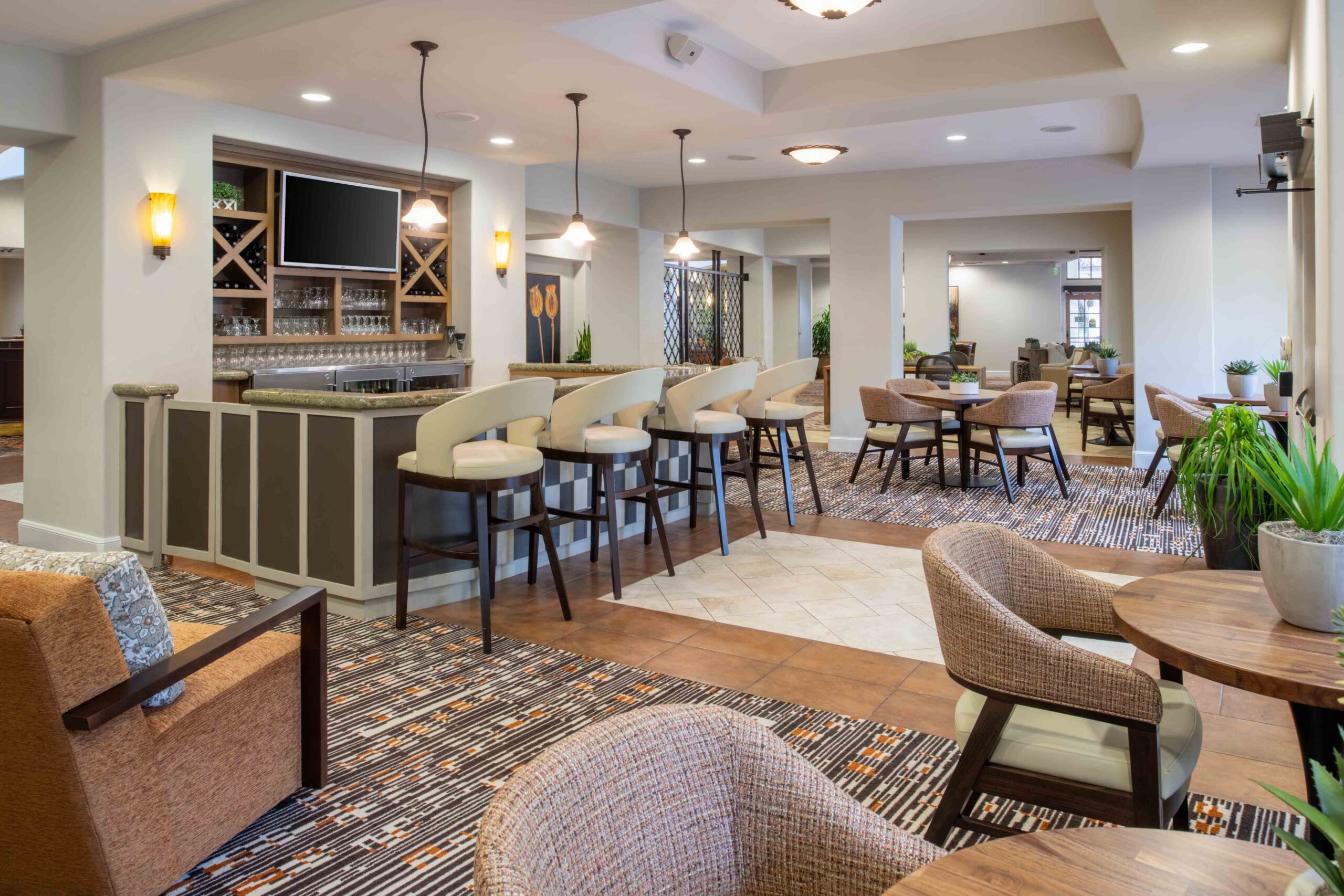 a bar in the middle of a large seating area in ocotillo