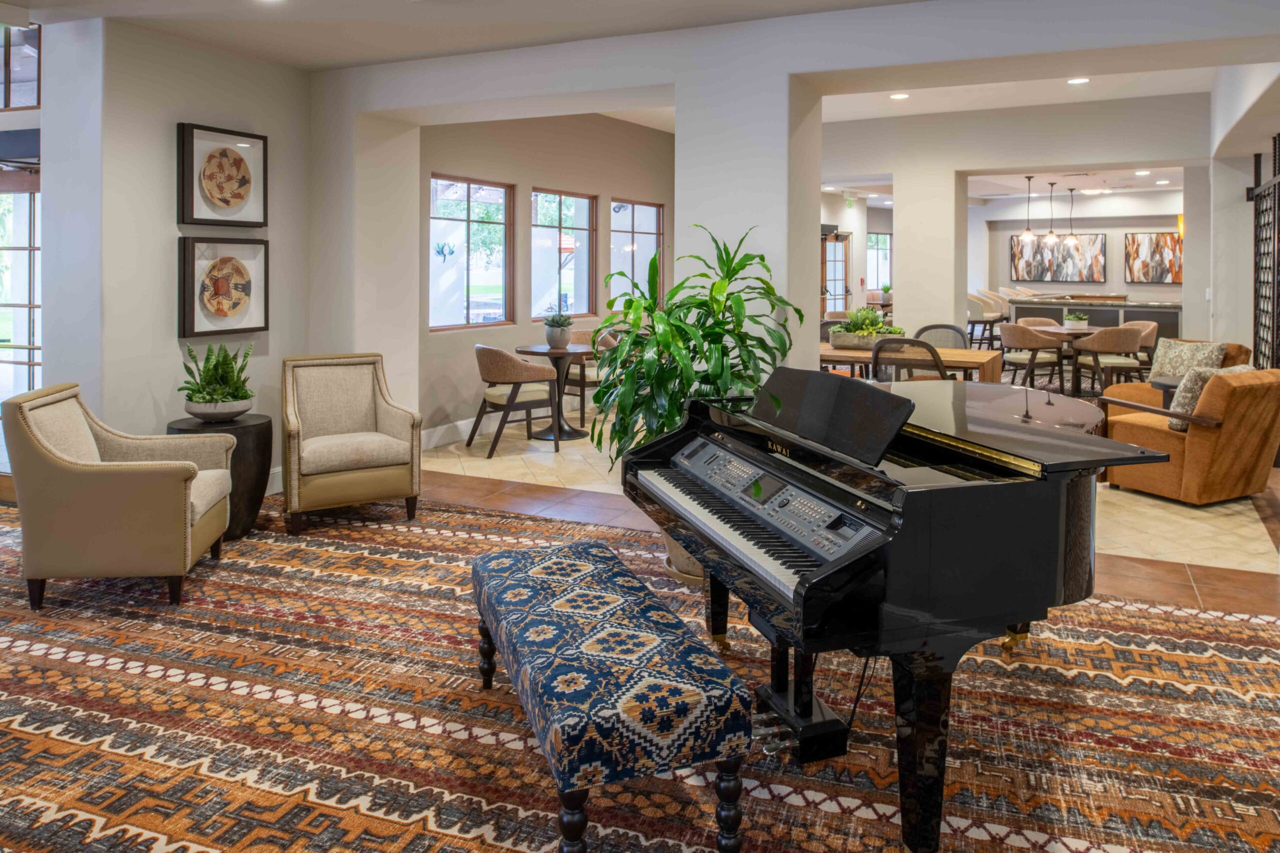 the public room at the village ocotillo with a grand piano