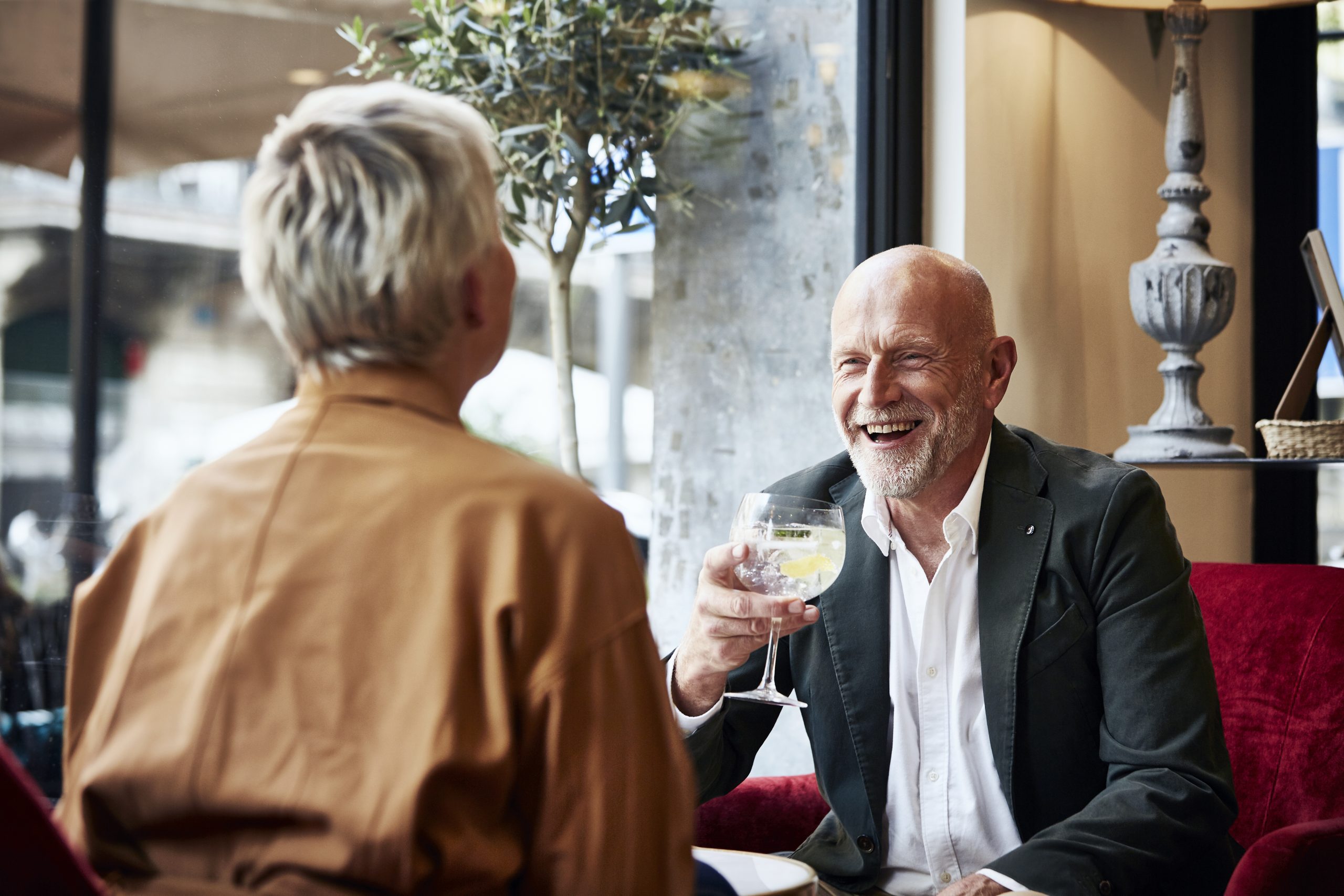 A couple enjoying drinks at a restaurant.