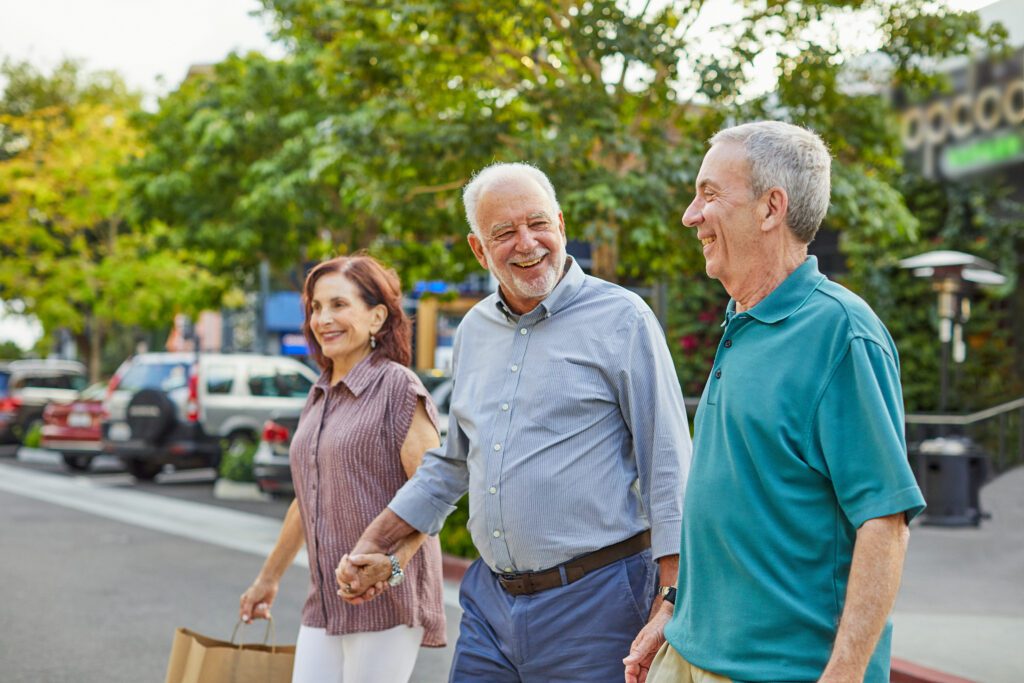 Senior couple runs into friend while shopping