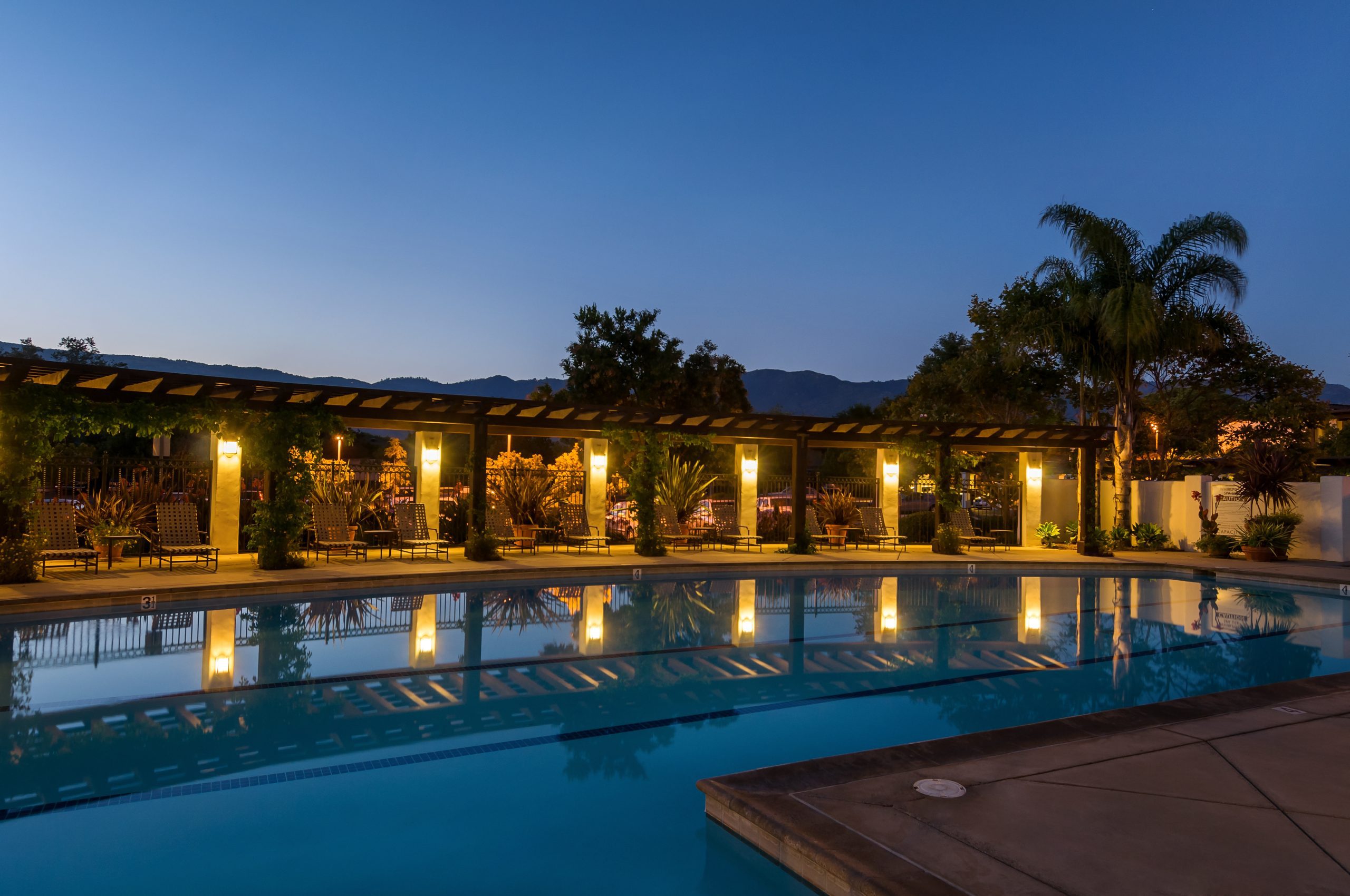 clubhouse pool lit at dusk 