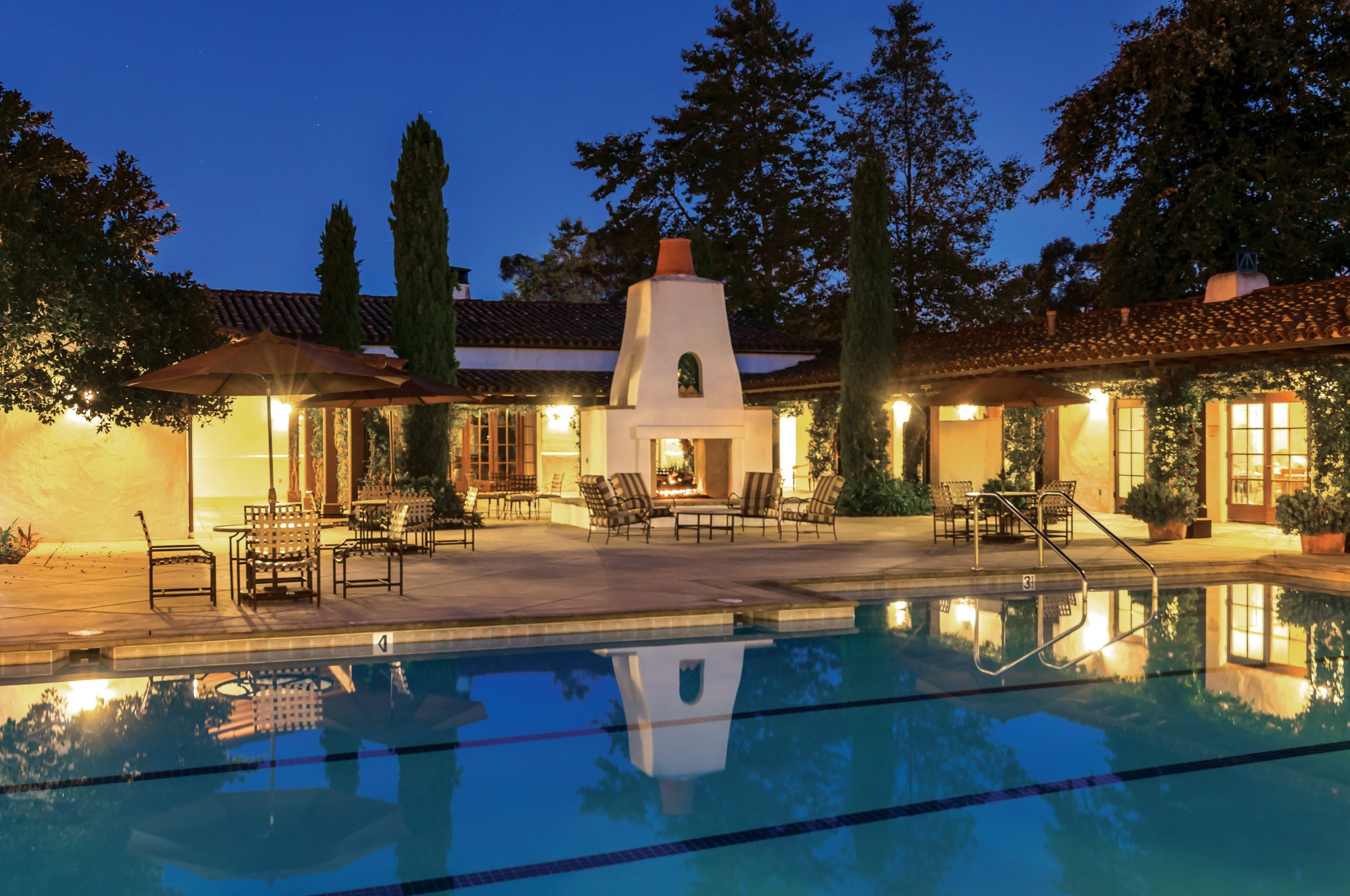 clubhouse pool lit at dusk 