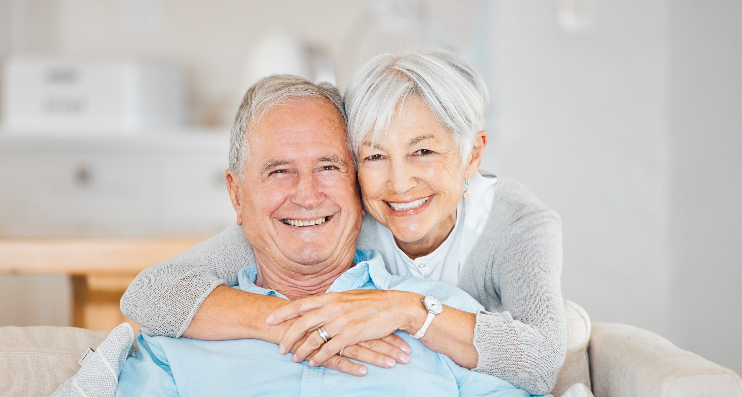 Happy senior couple hugging smiling taking photo