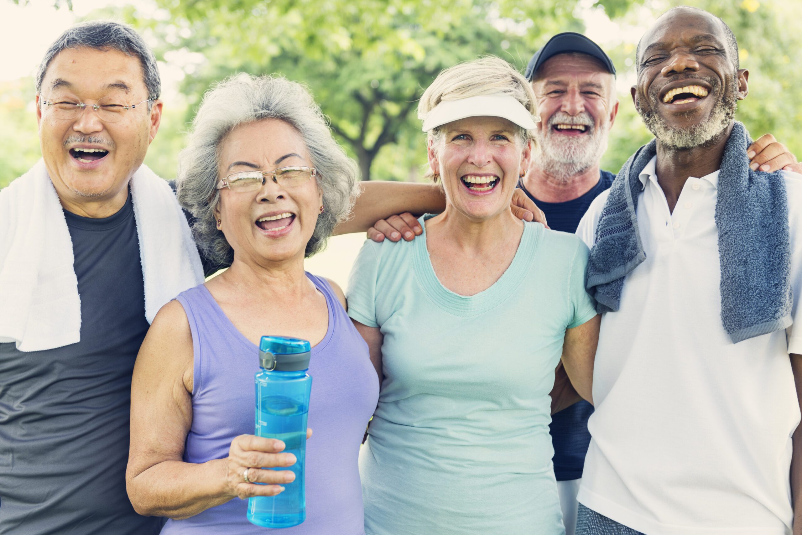 a group of happy elderly people that have just finished a workout together