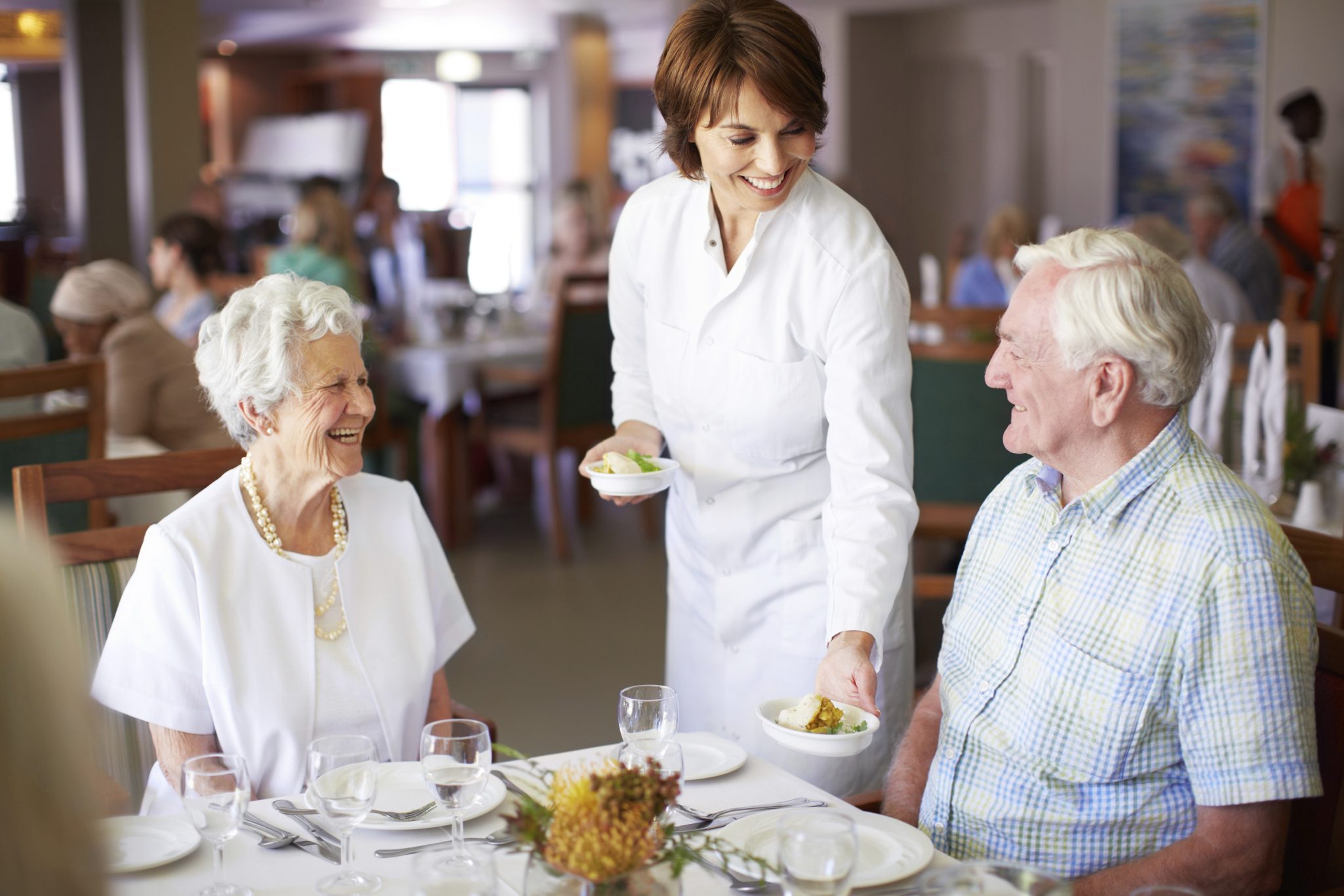 Image of senior couple dining at senior living community