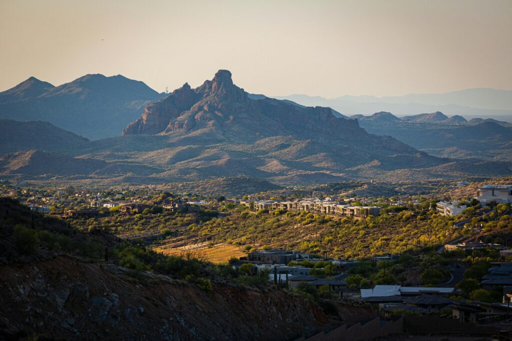 Aerial shot of community surrounded by mountains