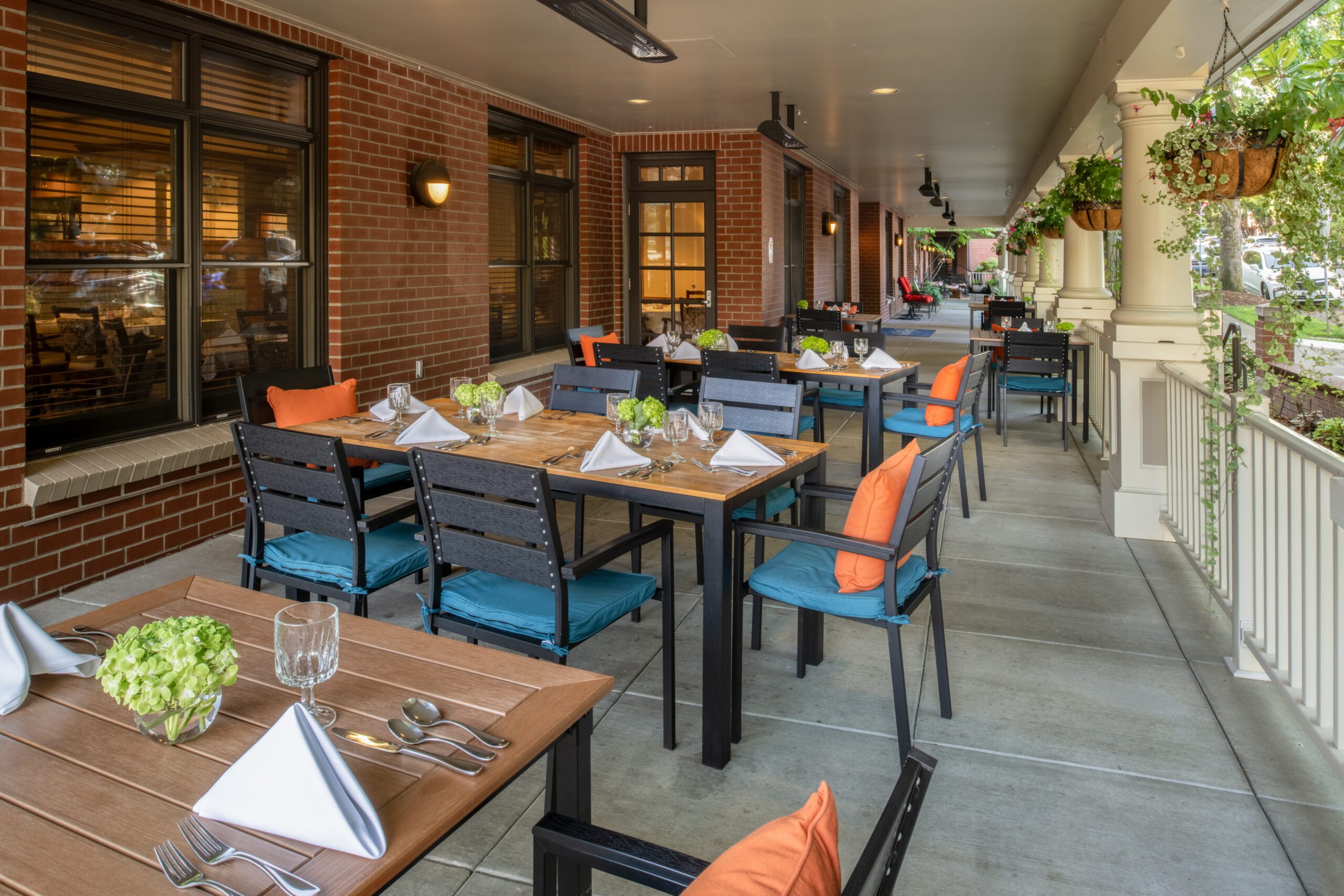 Outdoor dining at the inn on the corner of Broadway and Broadway. Enjoy a delightful meal in a charming setting.
